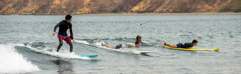 Surfing lessons to Playa Iguanita for beginners with instructor