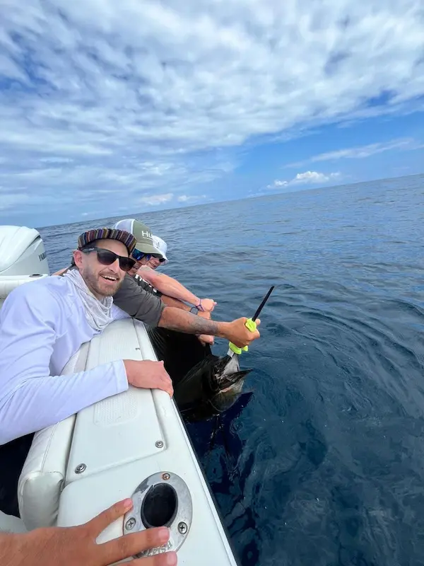 Fishing charter on board of the Sailfsh-II boat, catching a sailfish on deep sea fishing